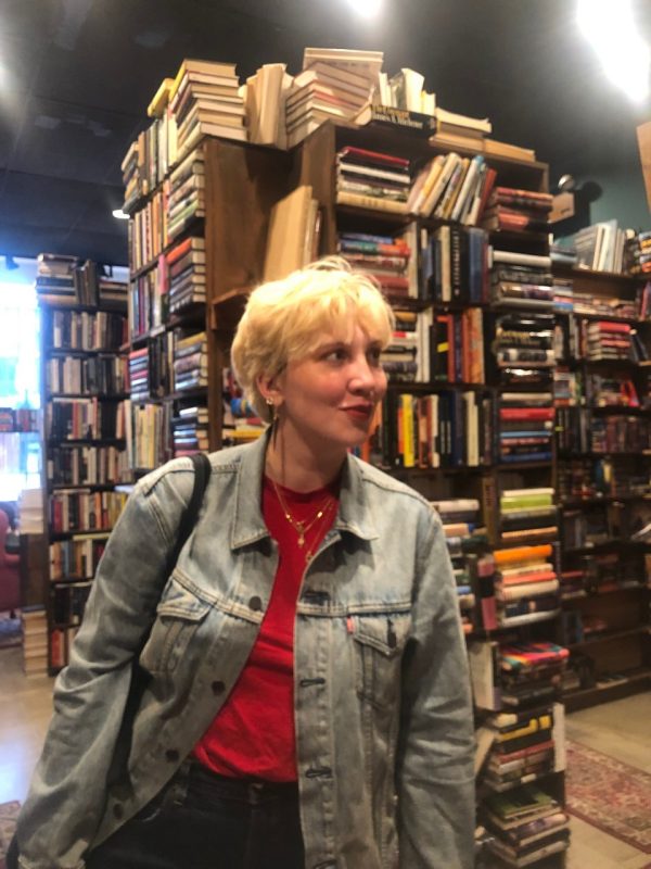 Photo of Victoria with books in background.